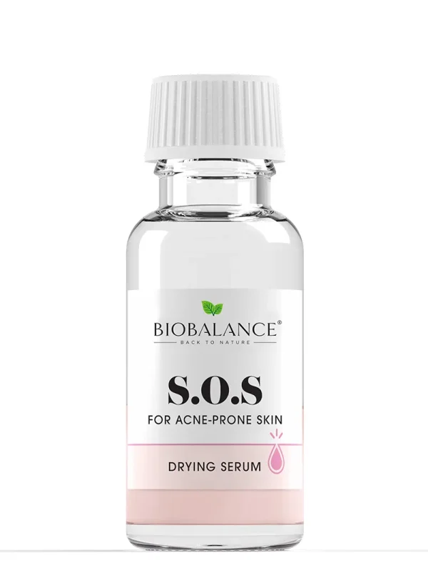A bottle of Biobalance S.O.S. Drying Serum with visible pink sediment at the bottom, labeled with hero ingredients like calamine, sulfur, salicylic acid, and zinc oxide.